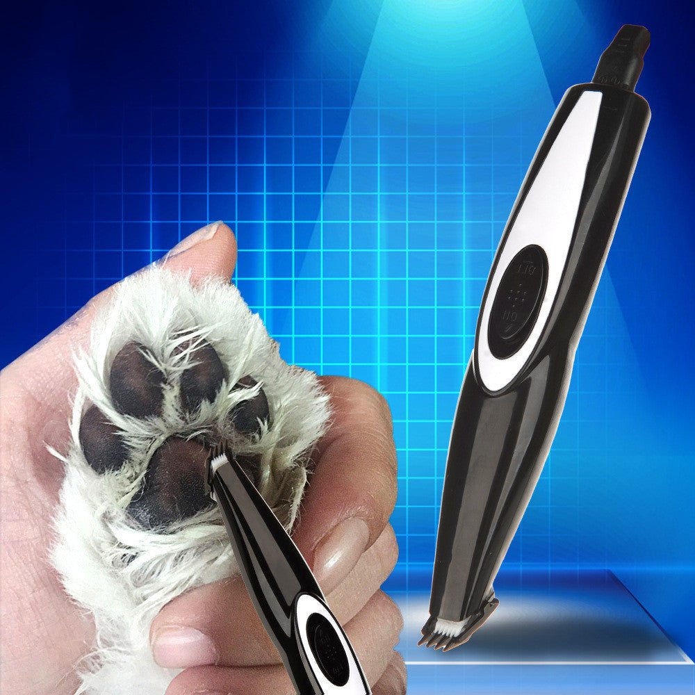 Pet shaving electric hair clippers trimming a dog's paw fur.