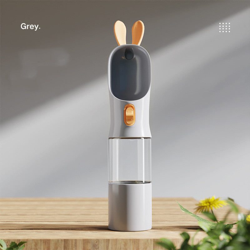 Gray portable pet travel water bottle with silicone parts.