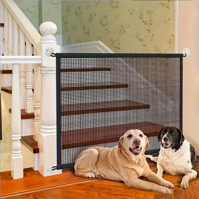 Pet isolation mesh safety fence at stairwell with two dogs in front.