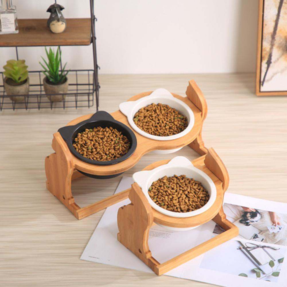 Wooden pet cat food bowls with ceramic dishes on a stylish stand.