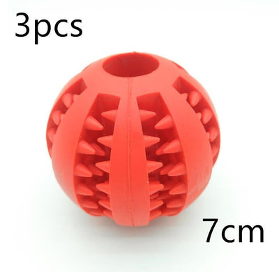 Red rubber feeder dog ball toy, 7cm, showing cleaning spikes.