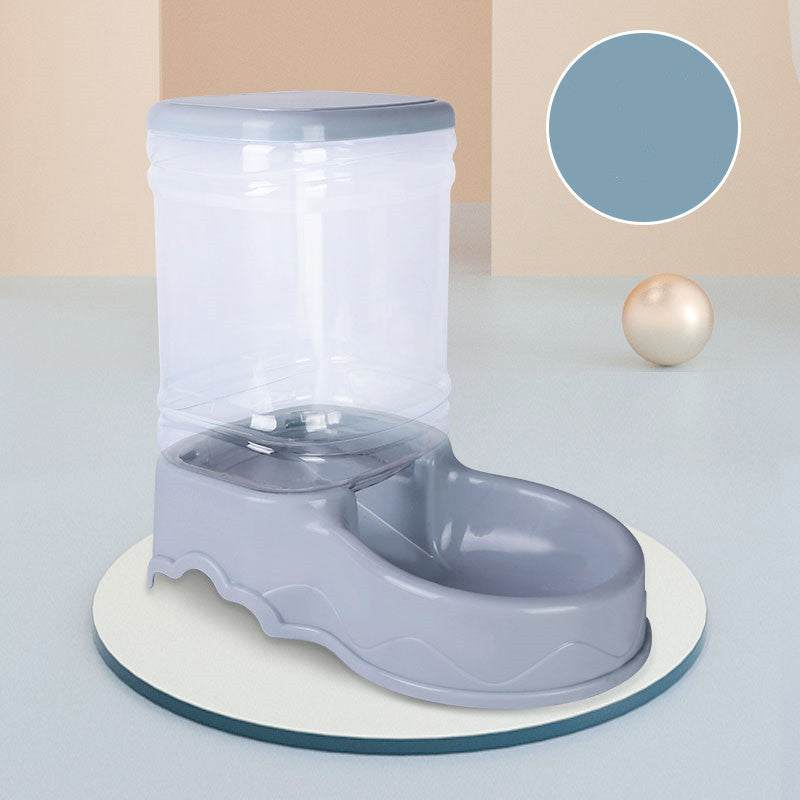 Dog automatic drinking fountain for pets with gray base and transparent water container.