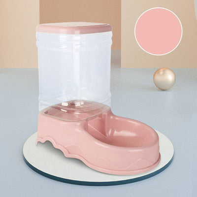 Dog automatic drinking fountain with pink base and clear water reservoir, suitable for pets.