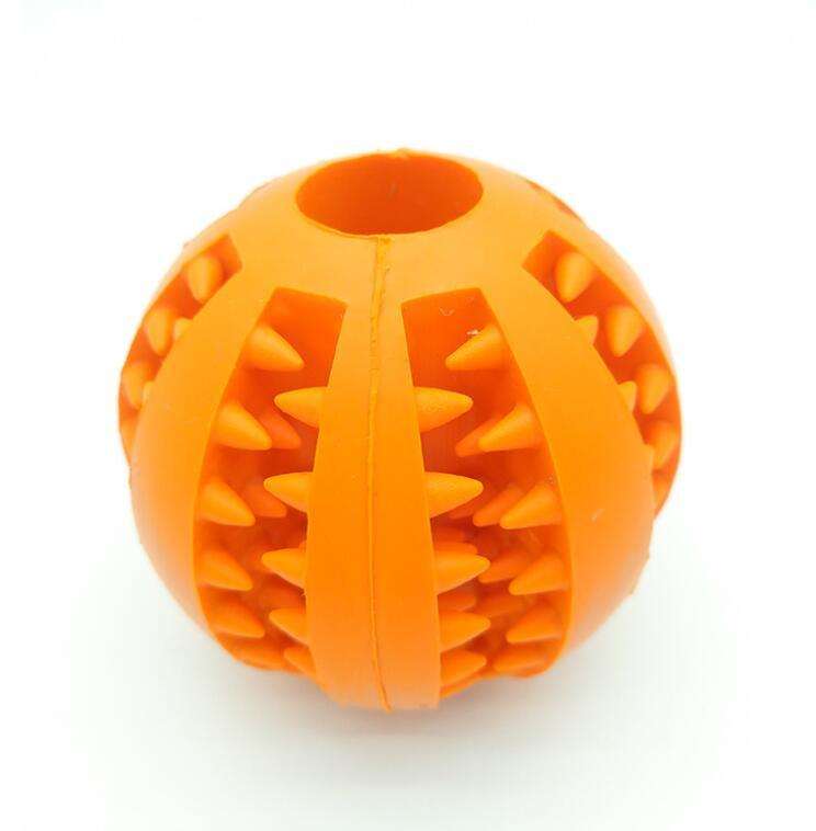 Rubber feeder dog ball toy, orange, tooth cleaning, food-grade material.