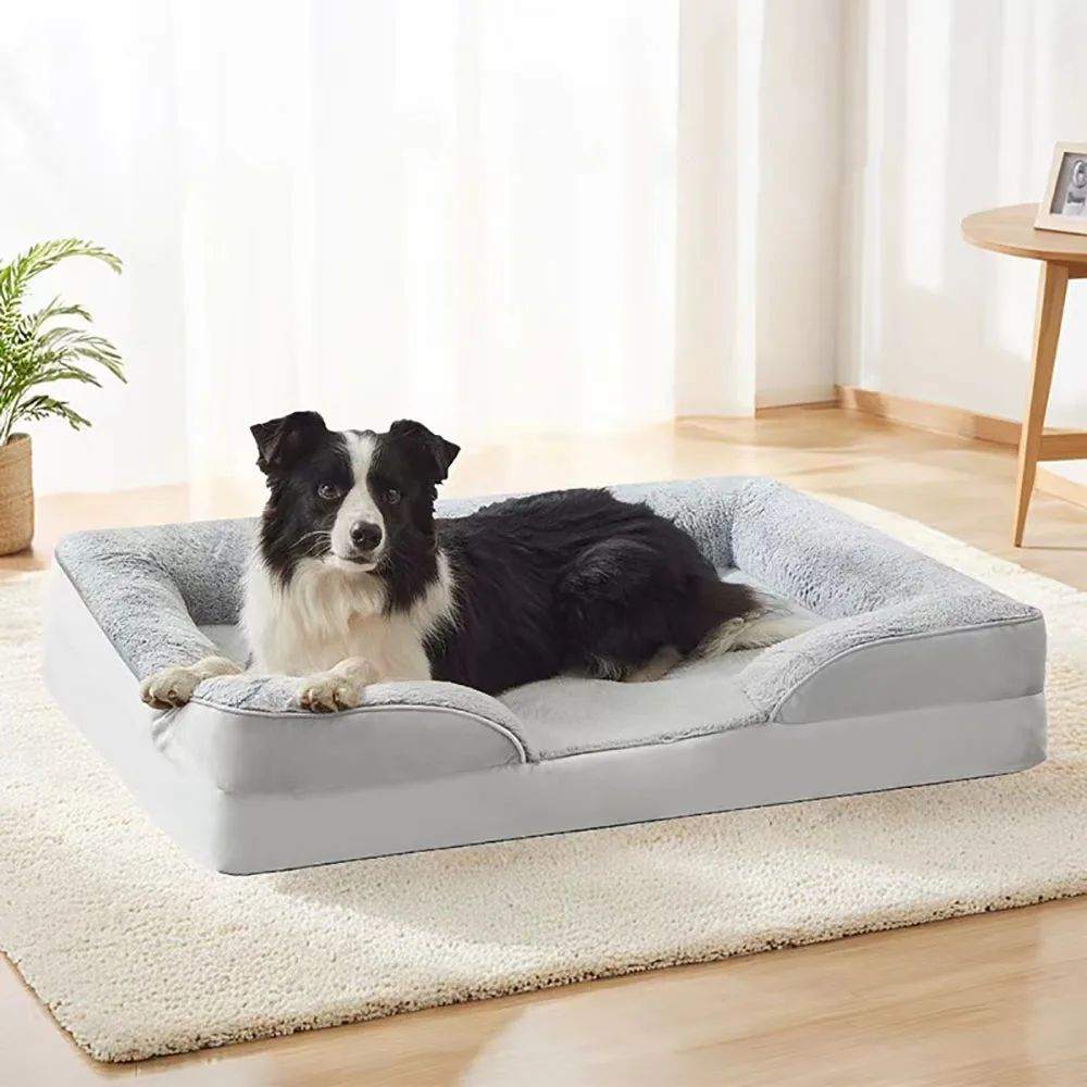 Dog lying on a high quality dog bed sofa mat in a cozy room.