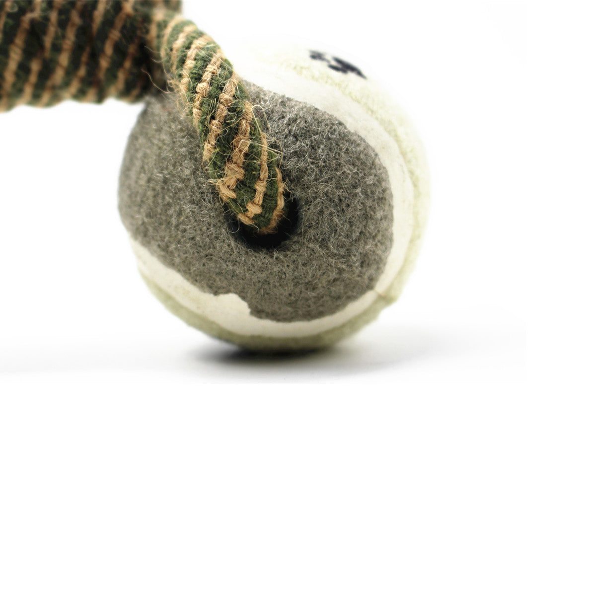 Braided cotton rope chew toy with tennis ball for teeth cleaning.