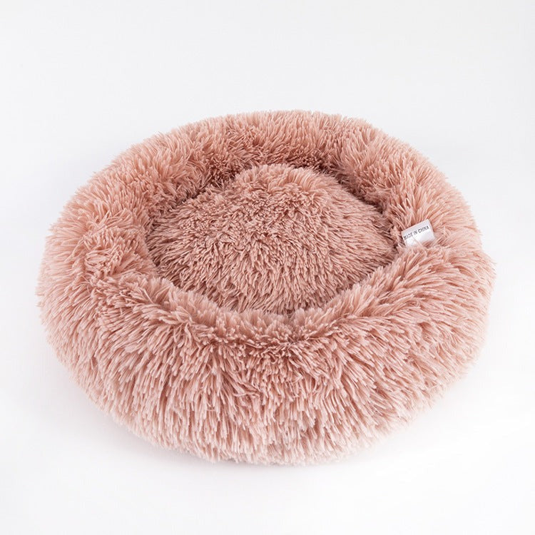 Fluffy non-slip pet cushion with anti-skid base, waterproof and durable.