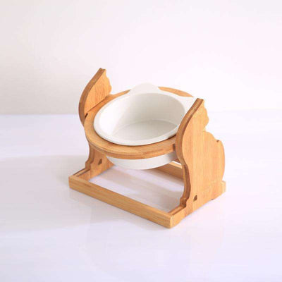 Wooden pet cat food bowl with ceramic bowl and wooden stand.