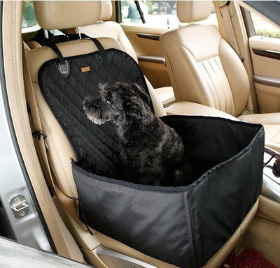 Waterproof pet seat pad protecting car seat with dog inside SUV.