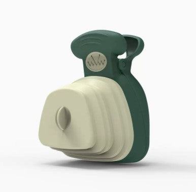 Pet poop bag dispenser and holder in green and beige silicone, compact design.