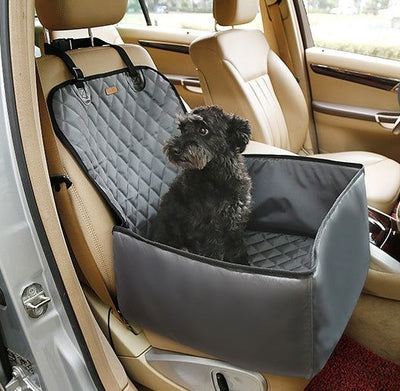 Waterproof pet seat thickening pad protecting car seat with a dog sitting.