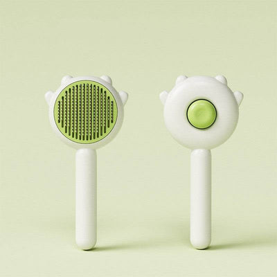 Cat Pet Magic Combs in green, front and back view, designed for hair removal with comfortable handle.