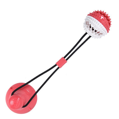 Pet molar chewing toy with suction cup, bite-resistant design, red and white with durable spikes.