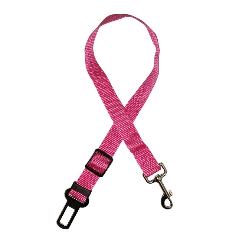 Pink pet retractable car seat belt with adjustable strap and metal clip.