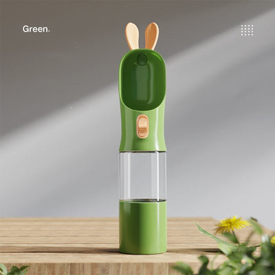 Green portable pet travel water bottle with silicone spout and 400ML capacity.