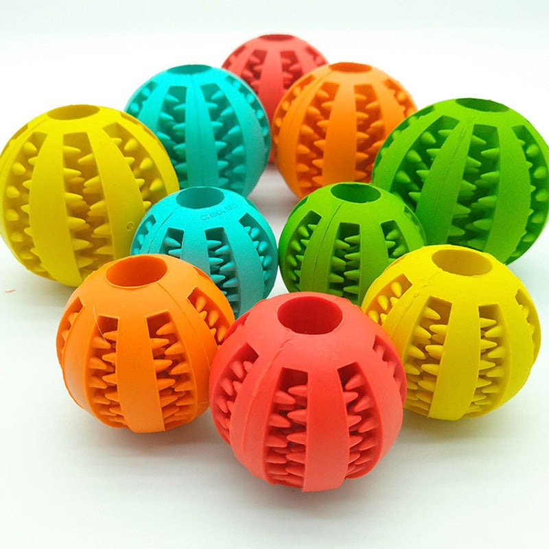 Colorful rubber feeder dog ball toy for cleaning teeth and play.