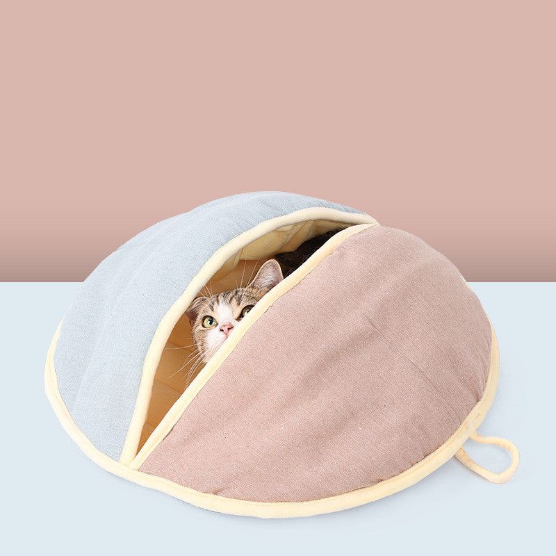 Semi enclosed pet nest in cotton and linen with a cat inside, pink and blue color, 55x60 cm.