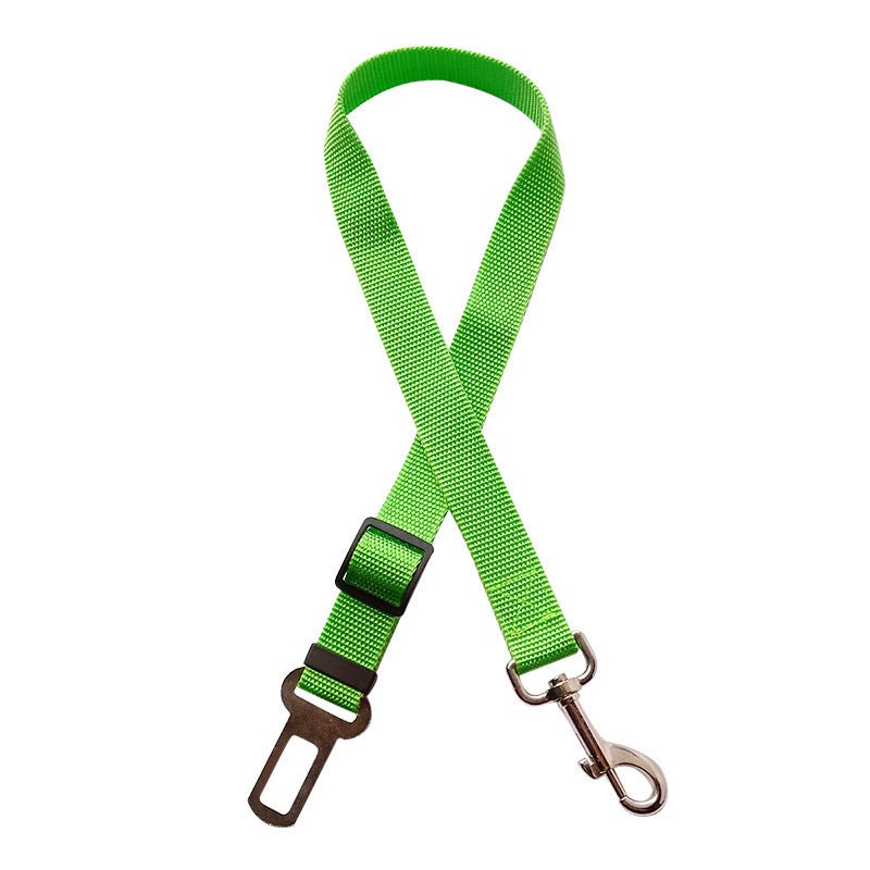 Green pet retractable car seat belt made of cloth material.