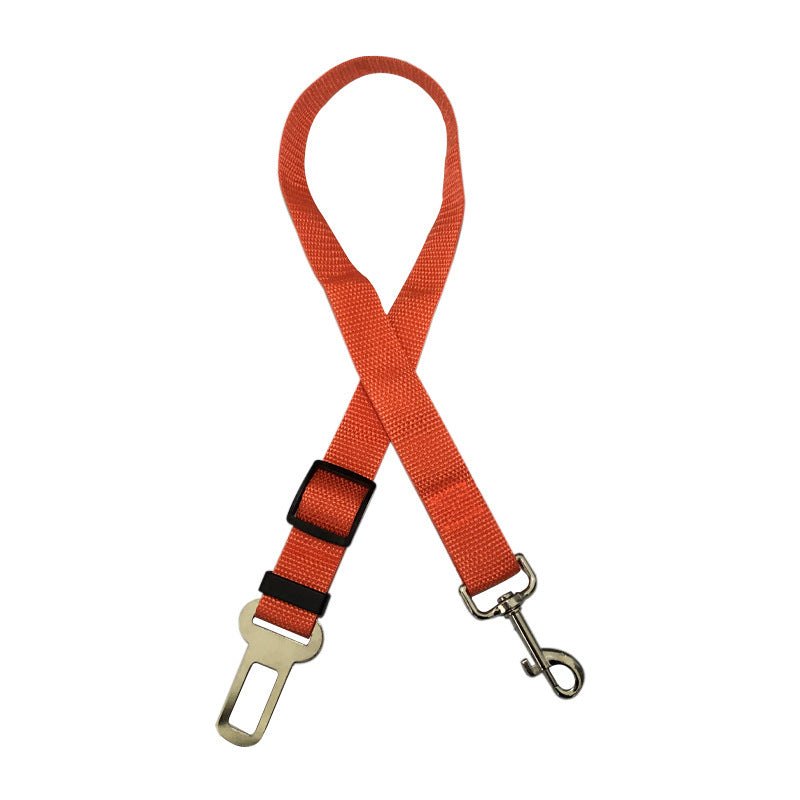 Orange pet retractable car seat belt with metal buckle and clip.